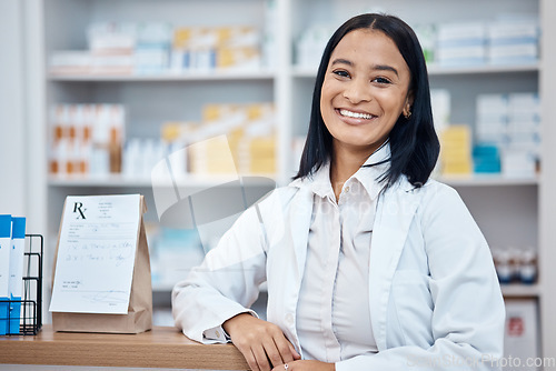 Image of Pharmacy portrait, medicine package and pharmacist in drugs store, pharmaceutical shop or healthcare dispensary. Hospital retail manager, pills stock product and happy medical woman for help support