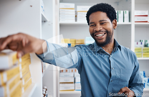 Image of Pharmacy, happy and black man shopping for medicine box, customer supplements product or drugs store pharmaceutical. Retail hospital shop, clinic pills shelf and client for medical healthcare choice