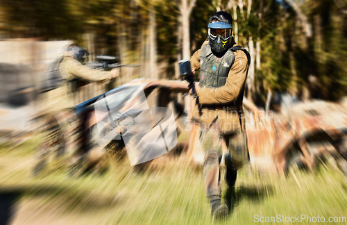 Image of Soldier, paintball and running with gun for intense battle or war in the forest pushing to attack. Active paintballer rushing or moving fast in extreme adrenaline team sport with weapon or camouflage