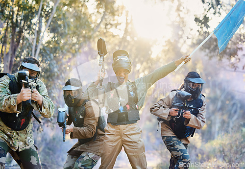 Image of Teamwork, paintball and capture the flag in celebration for winning, victory or achievement standing together in nature. Group of paintballers rally up for win, success or checkpoint with guns ready