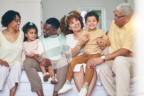 Image of Family, home and living room sofa of a mother, father and children with happiness. Happy, grandparents and bonding of a mom, dad and young kids together having fun with parent love and support