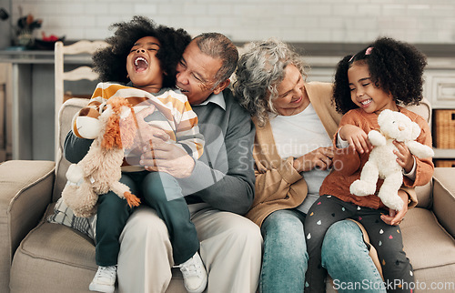 Image of Children, laughing or family with grandparents and grandkids bonding in the living room of their home. Kids, funny or tickle with a senior man, woman and grandchildren together on a sofa in the house