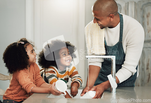 Image of Cleaning, help and happy with black family in kitchen for bonding, hygiene or teaching. Smile, support and natural with father and children at home for sanitary, responsibility or housekeeping chores