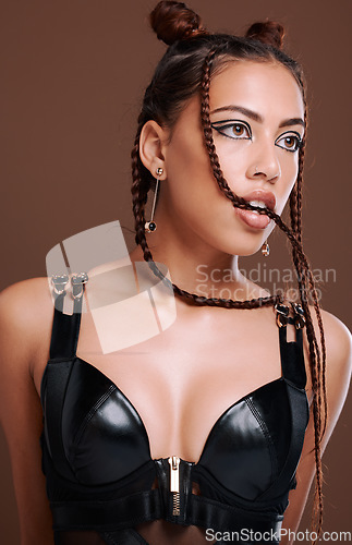 Image of Grunge, makeup and fashion for woman in studio with gen z aesthetic on brown background. Punk, rocker and edgy, cool girl posing, creative and confident with contemporary or unique style and attitude
