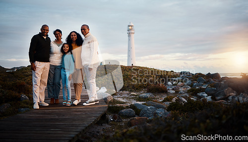 Image of Big family, portrait walking and nature bonding on a holiday at sunset by a sea lighthouse. Ocean, beach walk and outdoor with a mom, father and child together with love and parents support at dusk