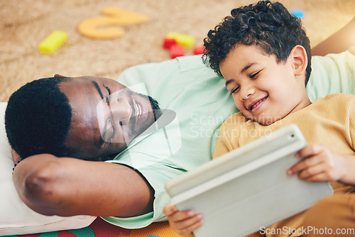 Image of Relax, streaming and tablet with father and son for elearning, bonding and watching subscription service. Happiness, technology and multimedia with black man and boy in family home for show and games