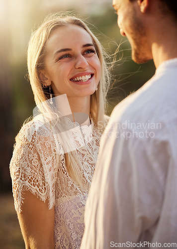 Image of Smile, happy and couple in nature for a date, honeymoon or valentines day. Happiness, admiration and laughing man and woman together at a park for romance, conversation and fun in relationship