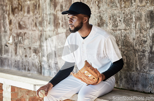 Image of Black man, baseball or catch glove on sports, stadium or arena bench for game, match or serious competition. Concentration, athlete or softball player mitten for fitness, workout or exercise training