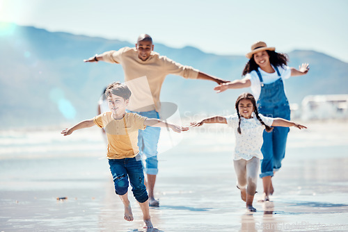 Image of Family, beach and parents running with children for bonding, quality time and adventure together. Travel, love and happy mom, dad and kids enjoy summer holiday, vacation and relax on weekend by sea
