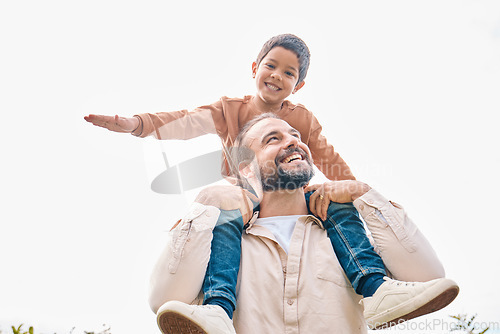 Image of Family, children and boy sitting on the shoulders of his father outdoor while bonding from below. Fun, kids and love with a man carrying his son outside while spending time together being playful