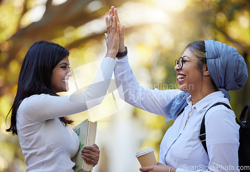 Image of High five, young women outdoor and friends with support, solidarity and happiness on college campus. Team agreement, happy female and success in class project, celebrate win and positive feedback