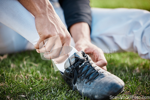 Image of Baseball player, shoes and joint pain, man with sport injury and emergency, first aid and injured ankle outdoor. Accident, muscle tension and hands, male on sports field and fitness with healthcare