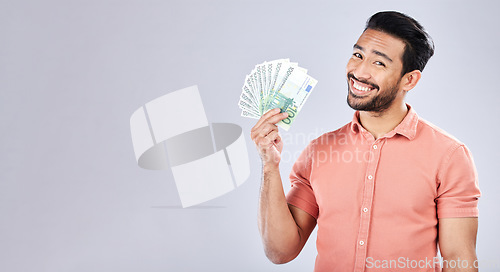 Image of Asian man, portrait and money fan on isolated background for financial freedom, stock market profit or investment. Smile, happy and trader cash on studio mockup for finance success, savings or growth