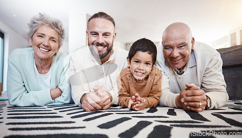 Image of Happy, portrait and family on the floor for bonding, playing and quality time. Smile, happiness and father, child and grandparents lying on the living room during a visit together in a house