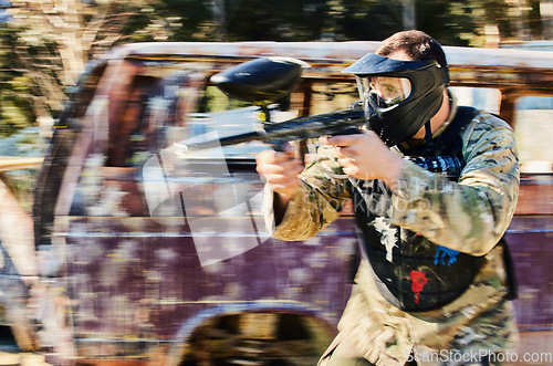 Image of Target, shooting and paintball man with gun for outdoor battlefield, playground or games in grunge adventure training. Aim skill of male player or sports person in military focus and survival mission