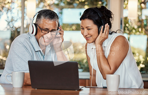 Image of Laptop, headphones and senior couple on video call in home, chatting and talking. Technology, computer and happy, elderly and retired man and woman in virtual conversation or online streaming