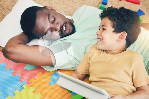 Image of Relax, father and boy on floor with tablet for playing, creative activity and fun learning with digital tech. Education, child development and dad and kid enjoy online game, internet and bond at home