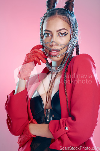 Image of Punk, goth fashion and portrait of a young woman with creative designer, teen and edgy clothing. Isolated, pink background and gen z model with cool beauty, bdsm rocker and funky style in a studio