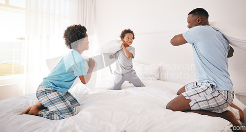 Image of Black family, pillow fight and father with children on bed for bonding, quality time and relax together. Love, happy and African dad laughing, playing and enjoy morning with kids in bedroom at home