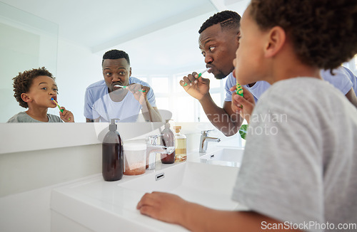 Image of Learning, brushing teeth and father with son in bathroom for dental, morning routine and cleaning. Teaching, self care and toothbrush with black man and child at home for wellness, fresh and hygiene