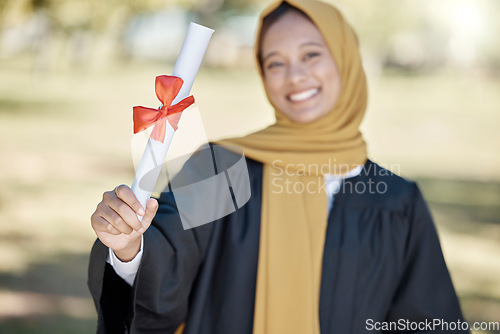 Image of Graduation, university diploma and Muslim woman with award for success, ceremony and achievement. Education, college and happy graduate smile with certificate, degree and academy scroll on campus