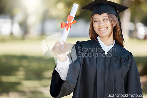 Image of Graduation, university diploma and portrait of woman on campus with smile for success, award and achievement. Education, college and happy graduate student with certificate, degree and academy scroll