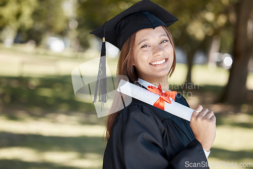 Image of Graduation, education diploma and portrait of girl with smile for success, award and achievement. University, college and happy female graduate with certificate, degree and academy scroll on campus