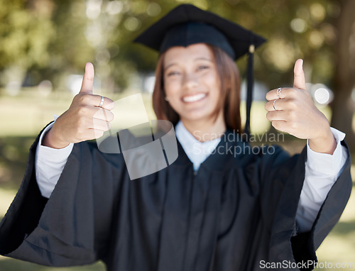 Image of University, graduation and student with thumbs up for success, award and certificate ceremony. Education, college and happy girl graduate with hand sign for goals, victory and achievement on campus