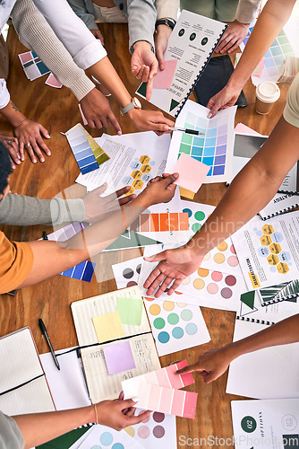 Image of Color, design palette and hands of business people on desk for branding meeting, strategy and marketing. Teamwork, paper and top view of designers brainstorming ideas, thinking and creative project