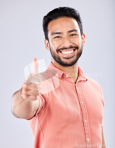 Image of Thumbs up, great and happy with portrait of man for vote, well done and promotion for good news. Opinion, smile and emoji with guy and positive hand gesture for thank you, agreement and approval