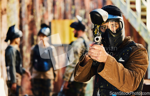 Image of Paintball, focus or portrait of man with gun in shooting game playing in action battlefield mission. War, hero or focused soldier with army weapons gear in survival military challenge competition