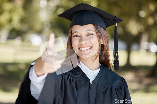 Image of Education, graduation and portrait of girl with thumbs up on campus for success, award and certificate ceremony. University, college and happy female graduate with hand sign for goals and achievement