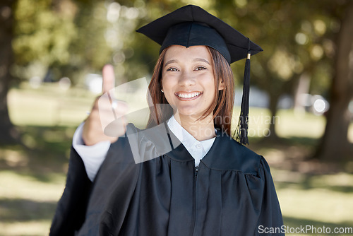 Image of University, graduation and portrait of girl with thumbs up on campus for success, award and certificate ceremony. Education, college and happy female graduate with hand sign for goals and achievement