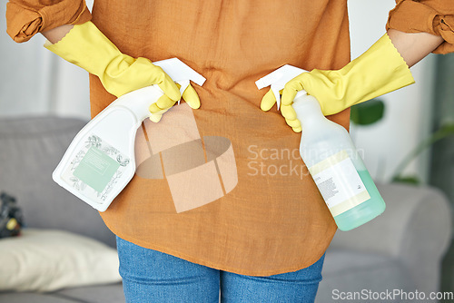 Image of Woman hands, spray bottle or back for spring cleaning, housekeeping or hotel maintenance with healthcare product. Zoom, cleaner or tired maid and detergent, liquid or bacteria in hospitality service