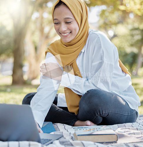 Image of Student, muslim and woman with laptop in park for elearning, studying or knowledge research. Islamic college, education scholarship and happy female with computer for internet browsing in university.