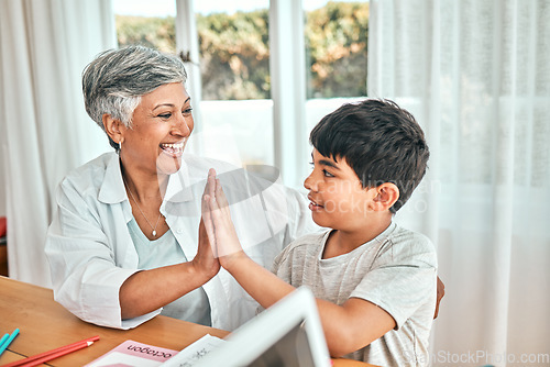 Image of Happy learning, high five and child education development at home with grandparent teacher. Teaching, elderly woman help and homework achievement hand gesture of a senior person and kid at a house