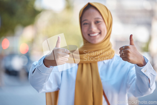 Image of Thumbs up, positive and portrait of Muslim woman in city for achievement, relax and natural in Indonesia. Islamic, youth and confident with girl wearing hijab in urban town for yes, agreement and joy