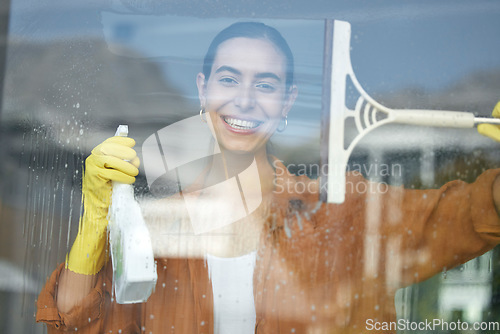 Image of Window cleaning portrait, smile and happy woman at home washing windows with glass cleaner. Helping, working and maid with spray detergent product for house chores and disinfectant wipe with squeegee