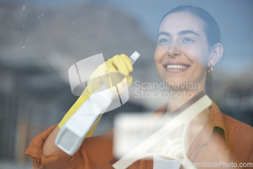 Image of Window cleaning, woman smile and happy maid at home washing windows with glass cleaner. Helping, working and girl with spray for squeegee and house chores and disinfectant doing housekeeping