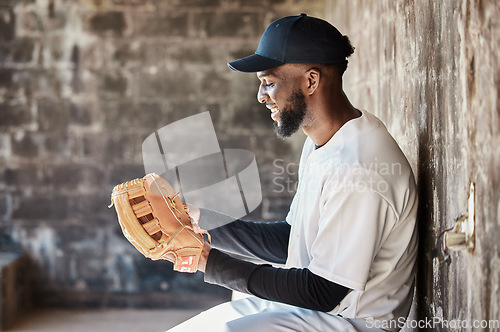 Image of Stadium, baseball and black man with ball, glove and ready for game, match and practice in dugout. Softball mockup, motivation and happy player prepare for training, exercise and sports competition