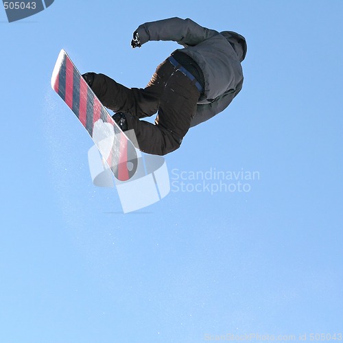 Image of Snowboarder jumping high in the air