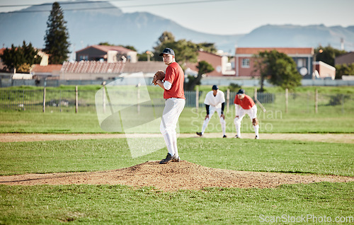 Image of Baseball pitcher, match and athlete throw or pitch ball in a game or training with a softball team. Sports, fitness and professional man or person in a competition with teamwork in a stadium