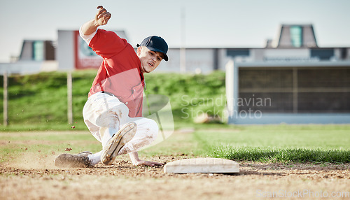 Image of Baseball, sports and man slide on field for competition, game or practice outdoors. Training, workout and player, athlete or male base runner in action match, exercise and competitive tournament.