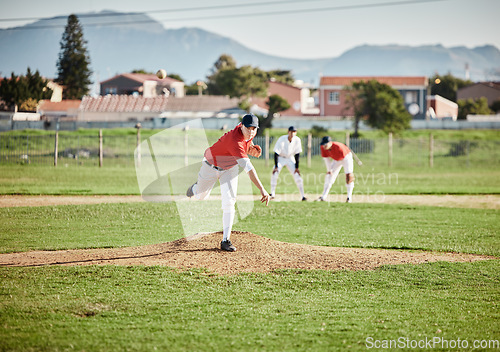 Image of Baseball player, competitive and athlete throw or pitch ball in a match, game or training with a softball team. Sports, fitness and professional man pitcher in a competition with teamwork