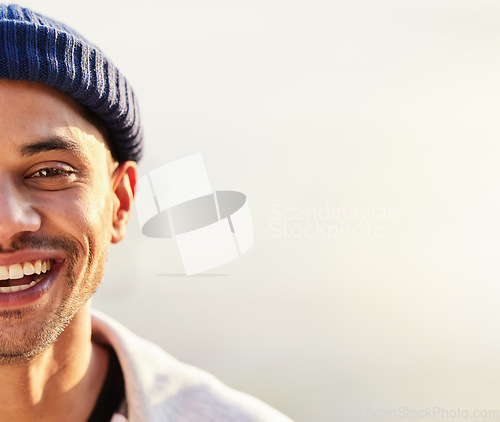 Image of Half, face and happy man with mockup space by hipster with a fashionable beanie on a simmer day with a smile. Guy, cool and side head of a stylish young male looking confident and excited