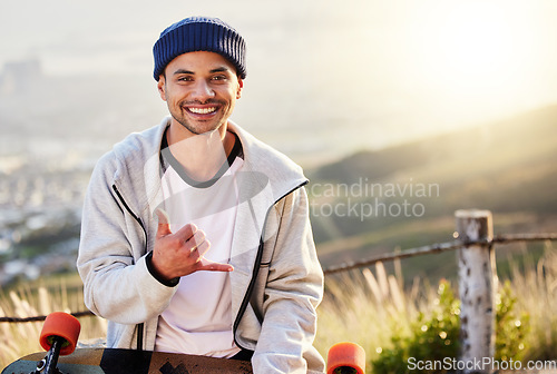 Image of Smile, portrait of skateboarder with shaka hand gesture and skateboarding hobby and skill on mountain. Freedom, fun and face of cool happy gen z man with happiness, longboard or skateboard and sports