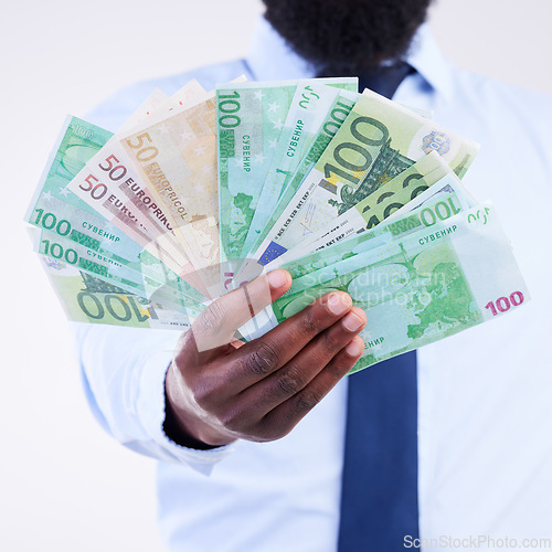 Image of Finance, money and hands of black man in studio for winner, investment and wealthy. Success, payment and profit with male holding cash isolated on white background for cashback, salary and rich