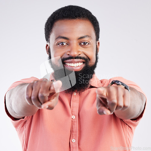 Image of Happy, pointing and portrait of black man in studio for yes, opportunity and decision. Yes, smile and deal with male and gesture isolated on gray background for agreement, thank you and choice