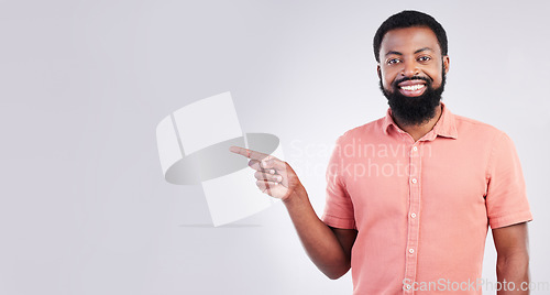 Image of Point, mockup space and portrait of black man with hand gesture for product placement, advertising and sign. Happy, studio and male smile on white background pointing for choice, branding and showing