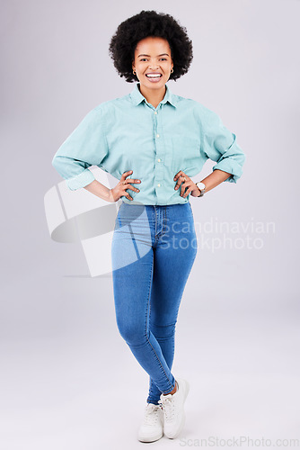 Image of Fashion, relax and portrait of black woman with stylish clothes standing isolated in a studio white background. Happy, excited and confident female person crossed legs in trendy outfit or clothing